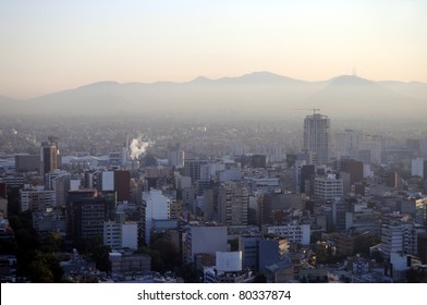 Hazy Skyline Of Mexico City At Dawn, Smog Covering Suburban Hills