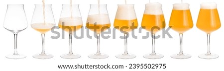 Hazy smoothie sour ale is pouring into tulip-shaped stemmed Tiku glass designed for a craft beer isolated on white background