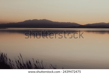 hazy sunset landscape of the etang de canet lagoon in France