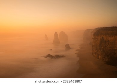 Hazy sunset over the Twelve Apostles on the Great Ocean Road, Victoria, Australia. Conditions were so foggy that you could not see the apostles in the distance.
