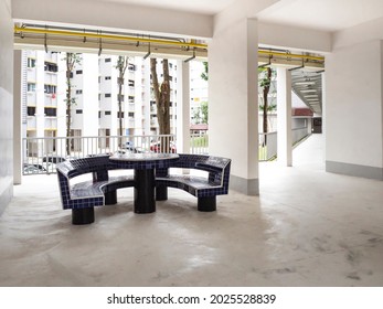 HDB Void Deck Area With A Bench And Table For Residents