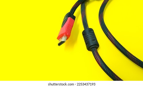 HDMI cable connector on yellow background - Shutterstock ID 2253437193