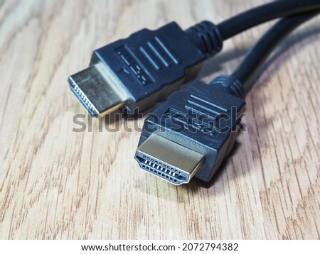 Hdmi cable on the table. High speed and high resolution connecting cable. High definition multimedia interface. Data transmission accessories
