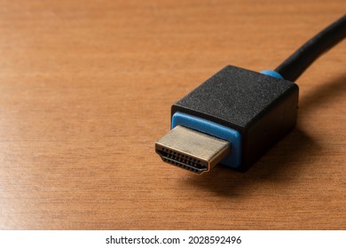 Hdmi (high Definition Multimedia Interface) Cable On Wooden Table