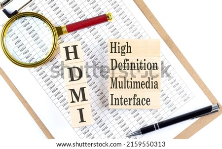 HDMI - High Definition Multimedia Interface text on wooden block on a chart background