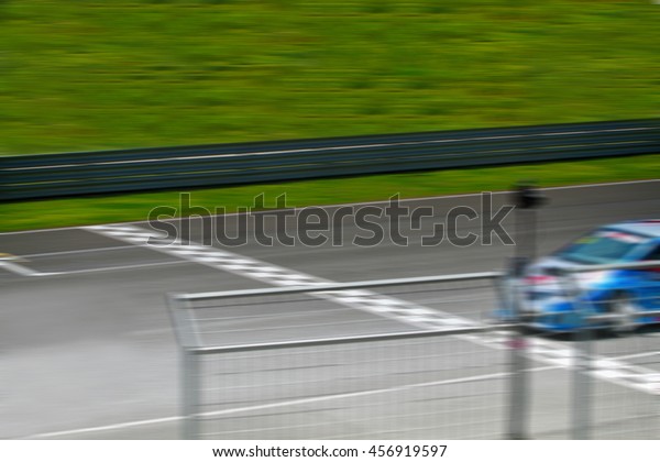 HDR Car racing finish\
line motion blur