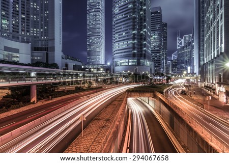 HDR image of Hong Kong rush and busy traffic captured at night in central district - with vintage color tone tuned