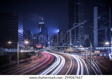 HDR image of Hong Kong rush and busy traffic captured at night in central district - with vintage color tone tuned