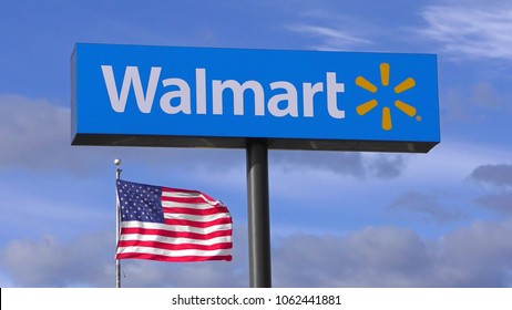 HDR image, Walmart store highway sign, US American flag waving - Saugus, Massachusetts USA - April 29, 2015