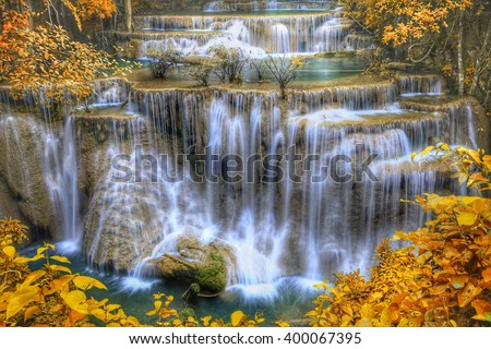 HDR landscape photo, Huay Mae Kamin Waterfall, beautiful waterfall in autumn forest, Kanchanaburi province, Thailand