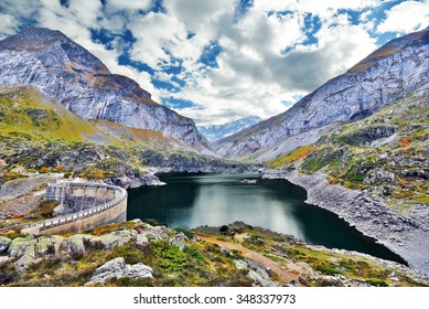 HDR Shot Of Gloriette Reservoir And The Dam In French Pyrenees, Estaube Valley And Circus Is In Center. The Ridge Of Chourrugue Is At Right, Hautes Pyrenees, France