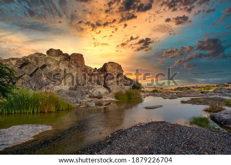 HDR sunset Landscape of Oman. wadi al khoud muscat Oman. Reflection view of Cloud and rock waterfall.