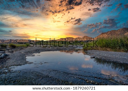 HDR sunset Landscape of Oman. wadi al khoud muscat Oman. Reflection view of Cloud and rock waterfall.