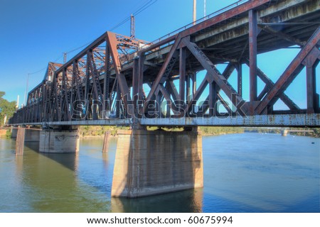 HDR tonemapped image of an old rusty train bridge