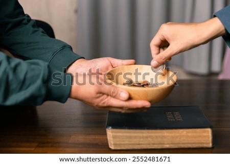He decided to donate portion of his earnings as tithe, giving money and coins as contribution to support financial needs of community. beg, quest, request, desire, need, problem, share, charitable