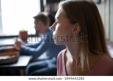 He did not come. Sad upset lonely young woman waiting for boyfriend beloved man at cafe bar pizzeria having problems feeling depressed suffering watching another people spending good time having fun