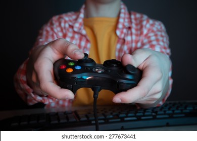 He like play and win video games. In blue light of display emotional kid play computer games online. - Shutterstock ID 277673441