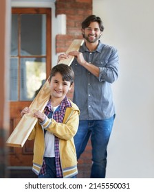 He Loves Helping His Father With Home Improvements. A Young Boy Helping His Father With The Home Improvement.