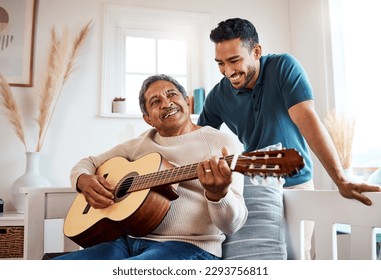 He loves listening to his dad play. Shot of a young man listening to his father play the guitar at home. - Powered by Shutterstock