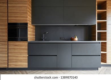 he modern kitchen is combined with facades made of natural veneer and painting in color anthracite - Powered by Shutterstock