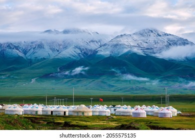 He Mountains And Mongolian Yurts In Bayanbulak Grassland Scenic Spot Xinjiang Uygur Autonomous Region
