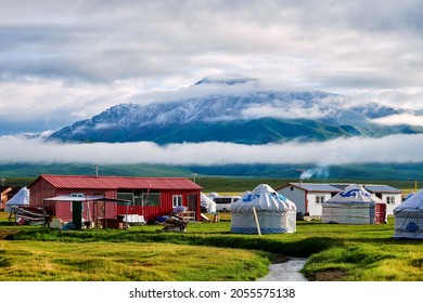 He Mountains And Mongolian Yurts In Bayanbulak Grassland Scenic Spot Xinjiang Uygur Autonomous Region
