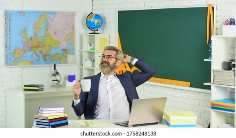 He Needs Fluid And Rest. Happy Man Drink Coffee In Teachers Room. Senior Teacher Rest During Work Day. Enjoying Break At Work. Rest During School Break. Rest Time Or Breaktime.