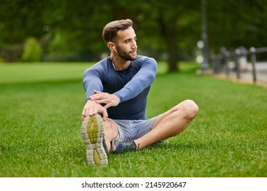 He Never Misses A Warmup. Full Length Shot Of A Handsome Young Male Runner Warming Up Before His Workout.