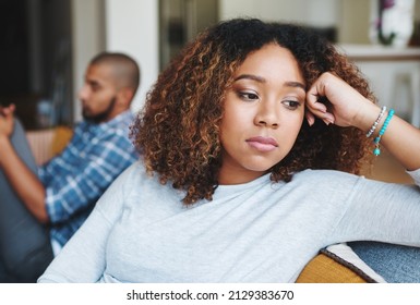 He really hurt my feelings. Cropped shot of an attractive young woman looking upset after an argument with her husband in their home. - Shutterstock ID 2129383670