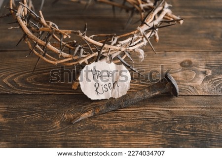 He is Risen. Jesus Crown Thorns and nails and cross on a wood background. Crucifixion Of Jesus Christ. Passion Of Jesus Christ. Concept for faith, spirituality and religion. Easter Day