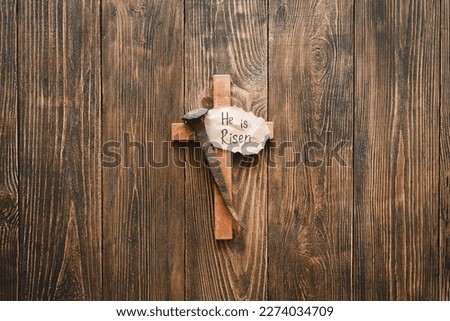 He is Risen. Jesus Crown Thorns and nails and cross on a wood background. Crucifixion Of Jesus Christ. Passion Of Jesus Christ. Concept for faith, spirituality and religion. Easter Day