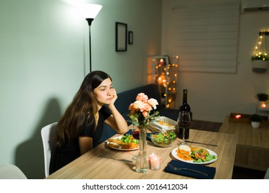 He Stood Me Up. Sad Young Girlfriend Feeling Upset While Waiting For Her Partner To Show Up For A Dinner Date At Home