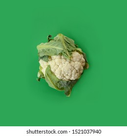 Head Of Cauliflower On Green Background