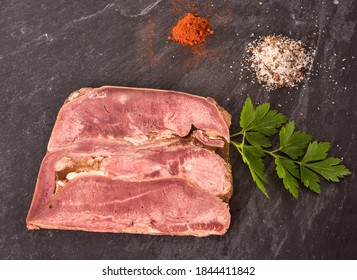 Head Cheese In Front Of White Background 