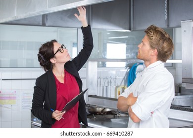 head chef supervising commericial kitchen - Powered by Shutterstock