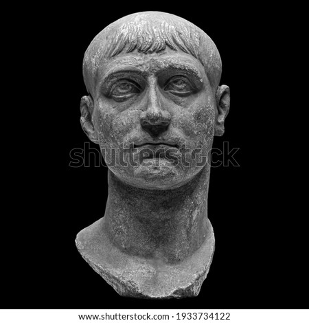 Head detail of the ancient man sculpture. Stone face isolated on black background. Antique marble statue of mythical hero character