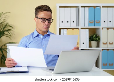 Head Of Digital Marketing Department Reading Annual Reports Of His Coworkers And Getting Ready For Meeting