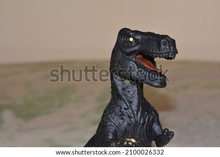 
Head of the Dinosaur, plastic toy, extinct reptile, children's toy, Brazil, South America, blurred background, copy space