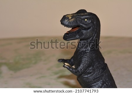 
Head of the Dinosaur, plastic toy, extinct reptile, children's toy, Brazil, South America, blurred background
