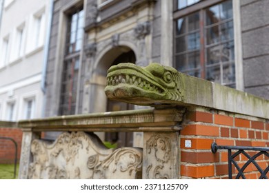 Head of dragon as decoration on old street in Gdansk, Poland - Powered by Shutterstock