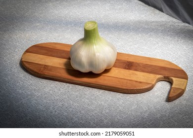 Head Of Fresh Garlic On Cutting Board. Allium Sativum - L. Fresh Garlic