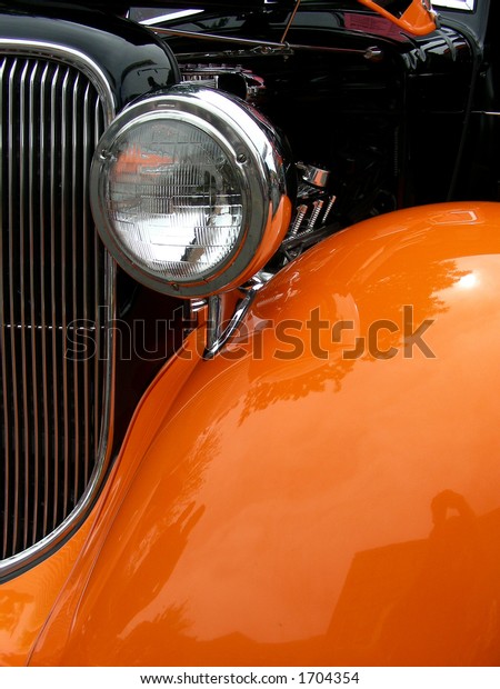 Head\
lamp, grill and fender on antique 1934\
automobile