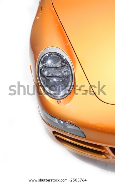Head lamp of Orange Porche\
car