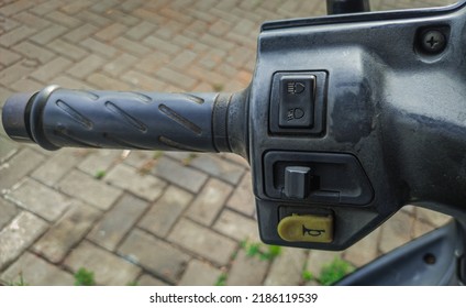 Head Light Switch, Horn Switch And Sign Light Switch On The Handle Of A Motorcycle