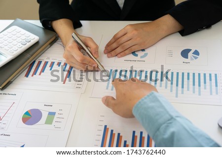 The head of male finance company is constantly checking sales that have skyrocketed from bar graphs and documents. With his secretary At the office desk this morning, Profitability concepts of finance
