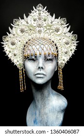 Head of mannequin in creative white kokoshnick with jewels and pearls 