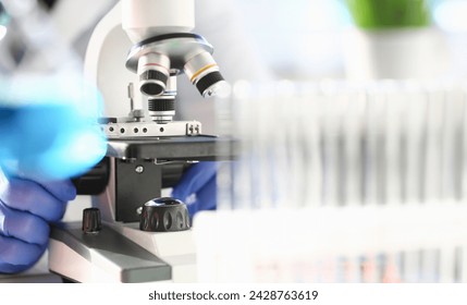 Head microscope on the background laboratory is a study human biology analyzes for non-compliance with the requirements organization public health at international level