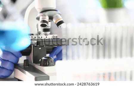 Head microscope on the background laboratory is a study human biology analyzes for non-compliance with the requirements organization public health at international level