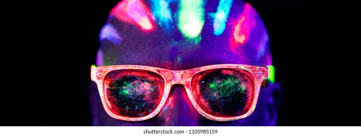 
 head in neon paint and glowing glasses, 
face in neon glasses close-up