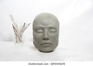 Head sculpture isolated and tools art craft on white background. Female mask portrait. - Shutterstock ID 2093194678